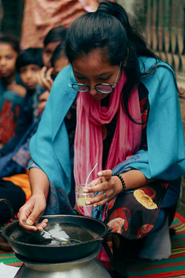 Young girls participate in an eco-friendly candle making workshop in Dhaka, Bangladesh.